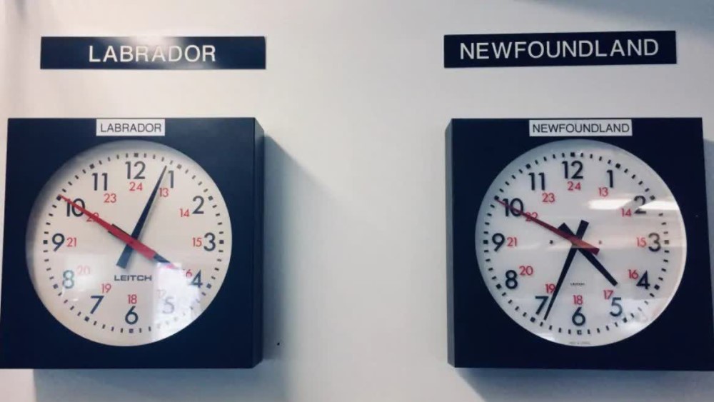 Two clocks are hanging together - the left one is with Labrador time, the right one with Newfoundland time